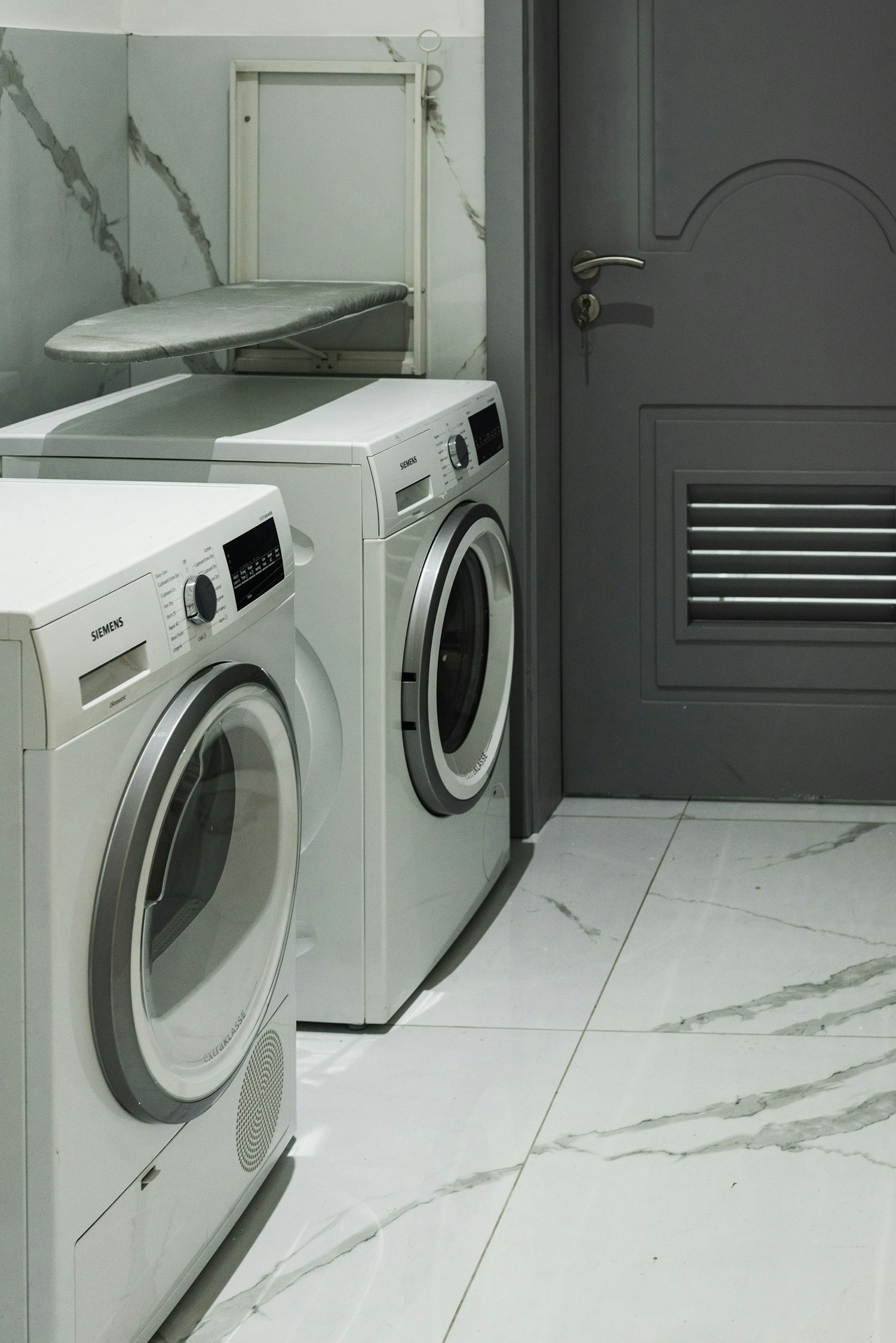 A washer and dryer sitting next to each other